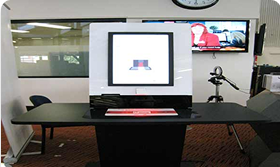 computer on a table with sign of Library Catalogue.